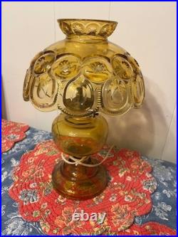 LE Smith electric lamp amber/yellow in color LE Smith electric lamp amber/yellow in color