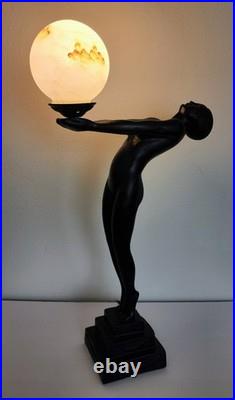 Vintage Max Le Verrier Reproduction Art Deco Female Sculpture Holding Globe Lamp Vintage Max Le Verrier Reproduction Art Deco Female Sculpture Holding Globe Lamp