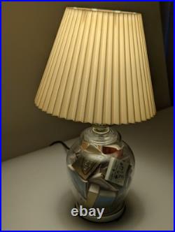 Vintage glass apothecary table lamp with matchbooks inside