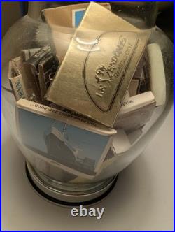 Vintage glass apothecary table lamp with matchbooks inside