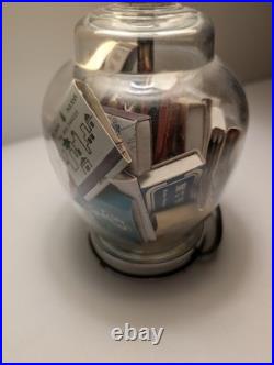Vintage glass apothecary table lamp with matchbooks inside