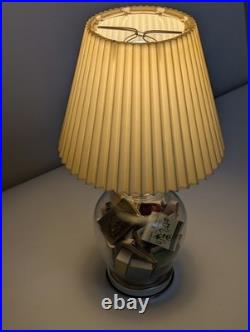 Vintage glass apothecary table lamp with matchbooks inside