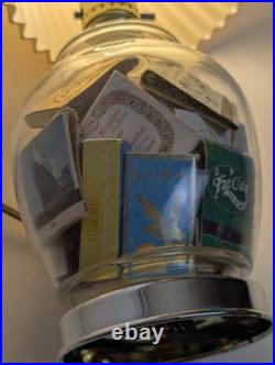 Vintage glass apothecary table lamp with matchbooks inside