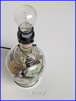 Vintage glass apothecary table lamp with matchbooks inside